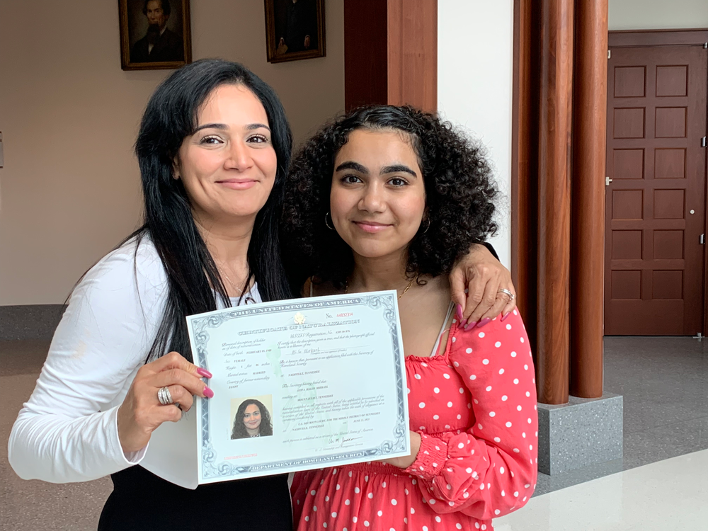 Afifa and her daughter after the citizenship ceremony.